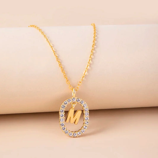 Initial gold necklace with circle in circonia